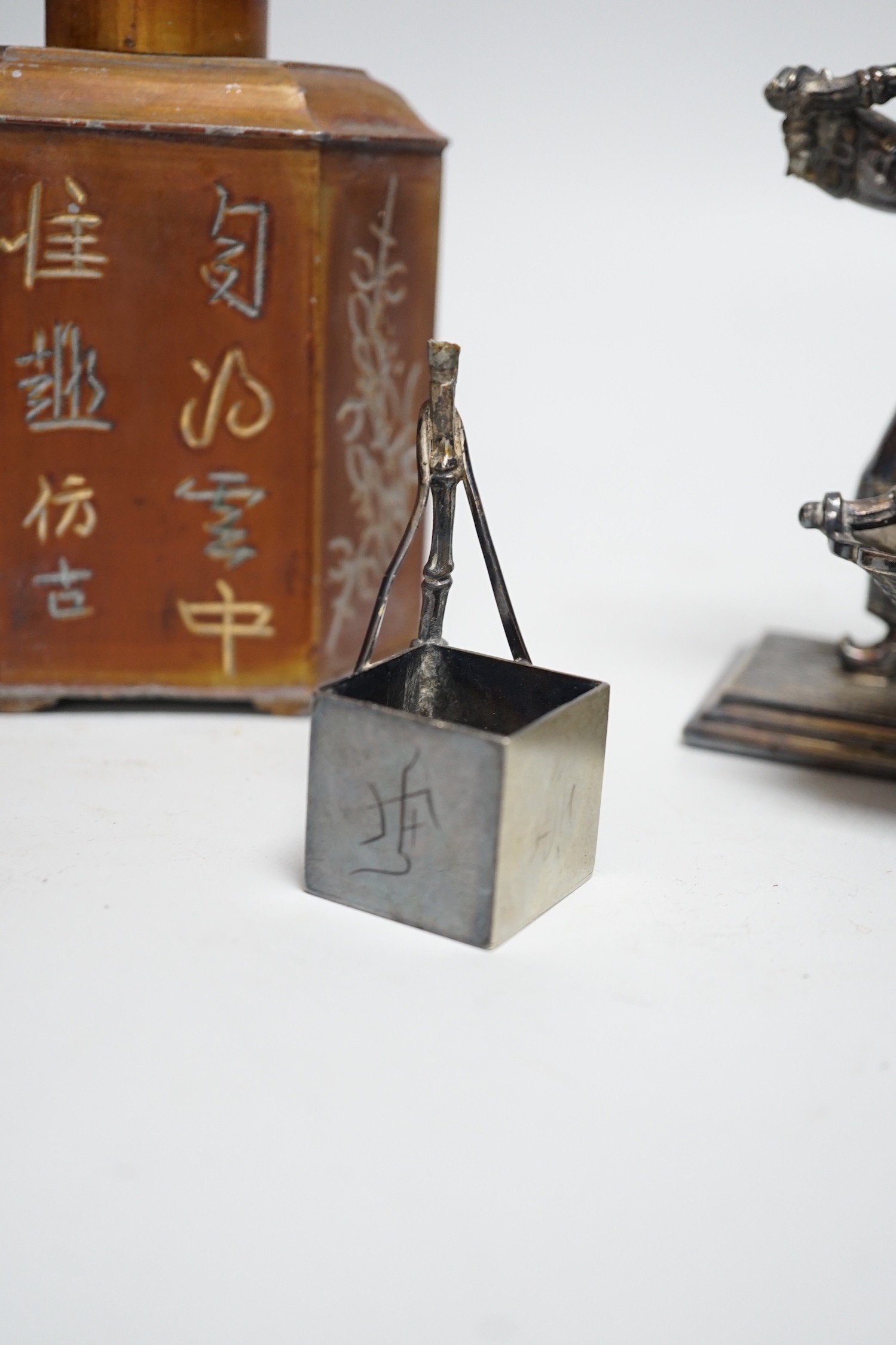 A Chinese pewter tea caddy and a Victorian plated figure of a Chinese basket seller, 16cm